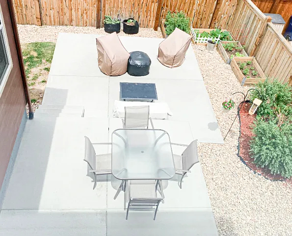 Backyard concrete patio, completely fenced.