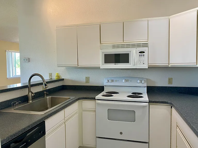 Newer counter tops, flooring and undermount sink.