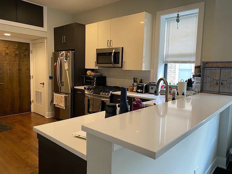 Kitchen showing breakfast bar