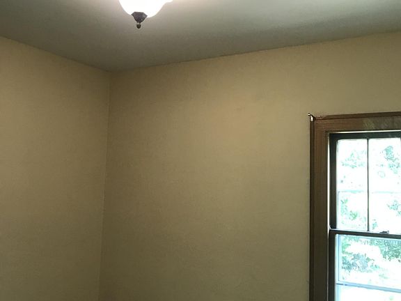 First floor back bedroom with view to back yard.