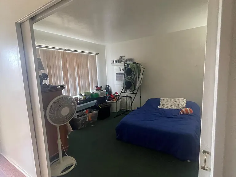 doors open to small bedroom green carpet will be clean and swiss coffee semi gloss paint