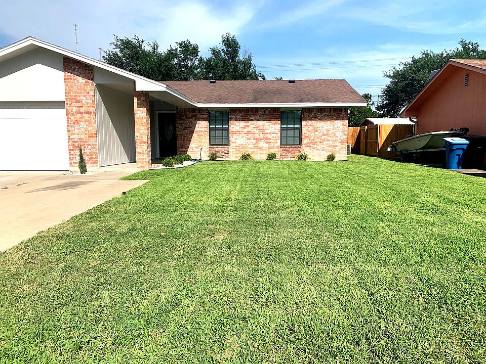 Beautiful curb appeal with inviting front entrance and landscaping to create a warm welcome