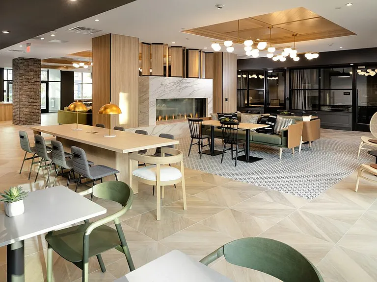 Lobby and leasing area with fireplace and lounge seating