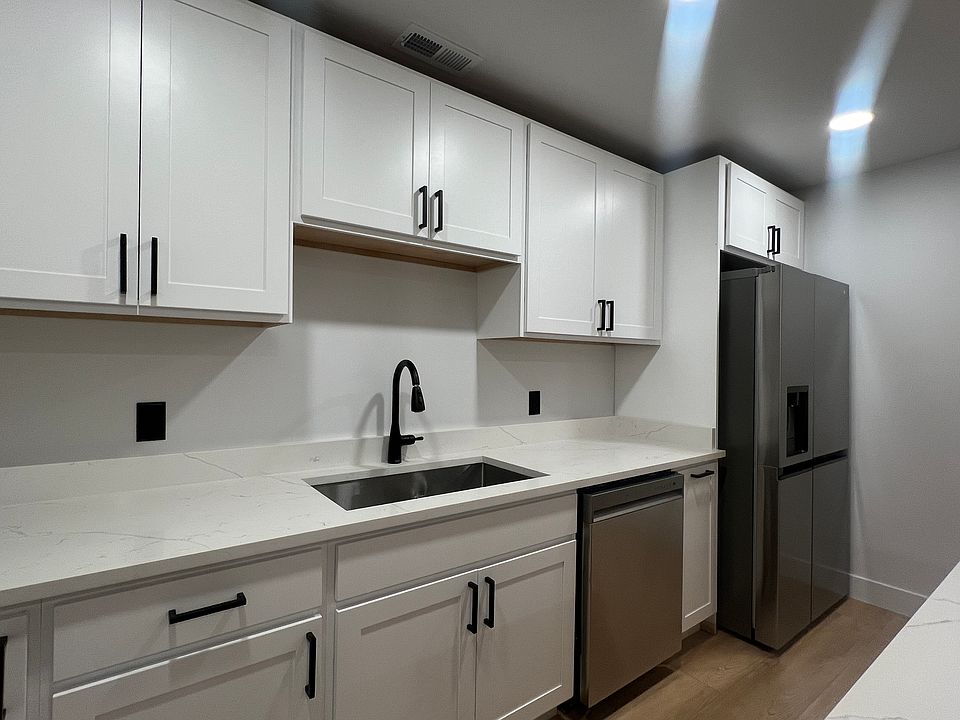 The spacious kitchen comes equipped with brand-new, top-of-the-line appliances, including an LG refrigerator, LG microwave, LG dishwasher, and a 36-inch Cosmo convection oven, ideal for culinary enthusiasts.