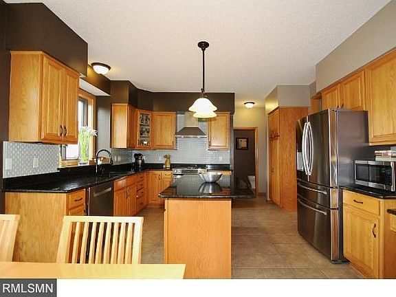 The center island kitchen has been updated with granite counters, new lighting,new Jenn-Air Stove that includes a grill for winter grilling, and a new custom stainless steel hood. Also all new stainless steel appliances