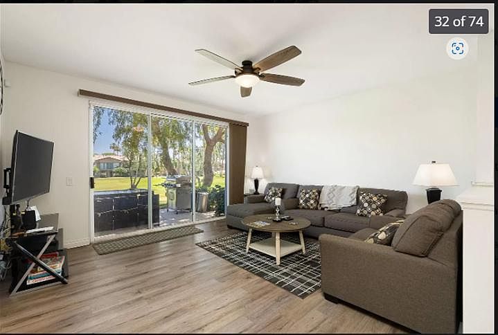 Cozy meets contemporary_this living room invites you to unwind in style. With the endless views of the 5th hole.