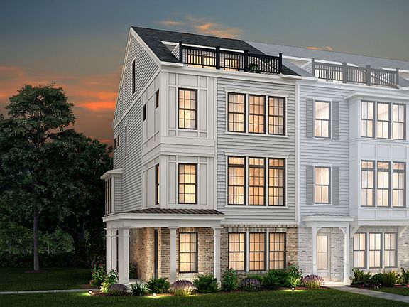 Bainbridge Exterior 26 features James Hardie TM siding, brick, covered front porch, terrace and 2 c