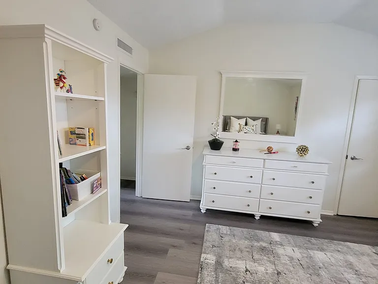 Master bedroom, queen size bedroom set. (2 night stands, books case and dresser and a rug)