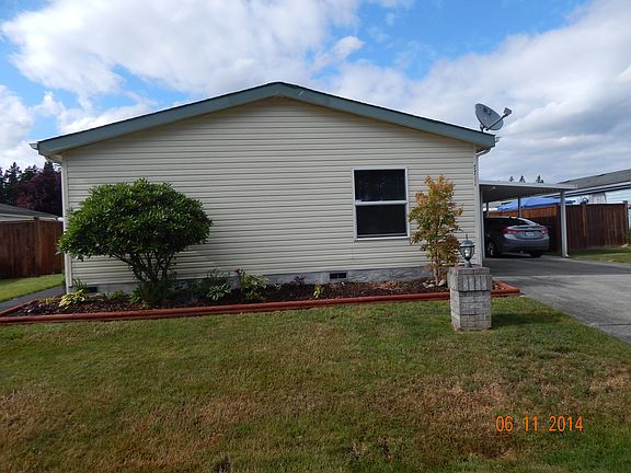 Front - 2 car carport & shed