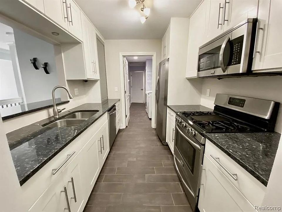 Custom IKEA Kitchen. Soft-close drawers and cabinets. Norway Blue Pearl Granite Countertop.