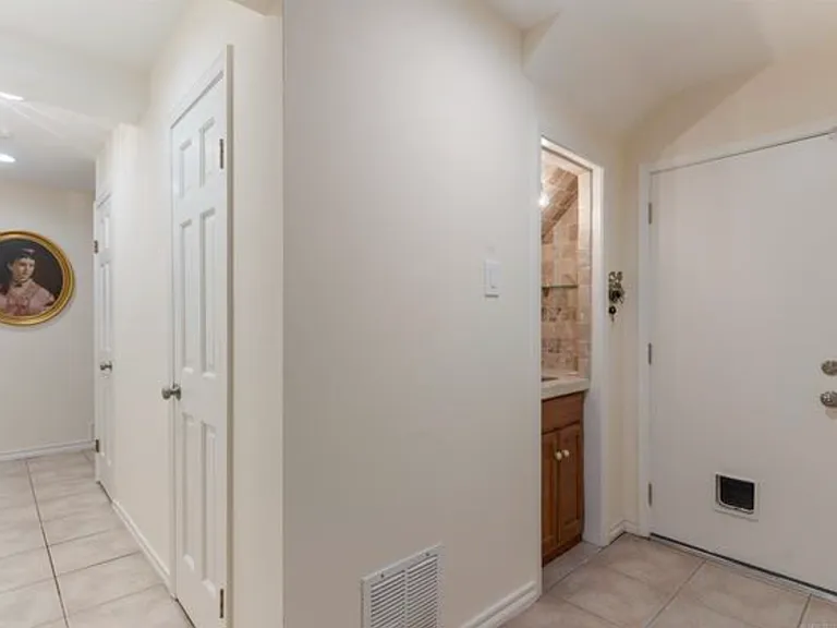 Wet bar on ground floor next to garge door