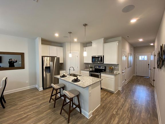Alternate view of entryway/kitchen. Staged unit - does not come furnished.