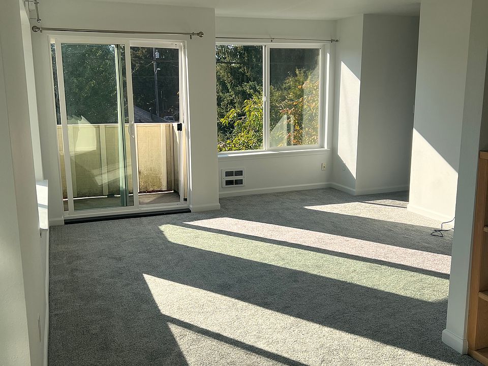 Living room, dining area, and balcony