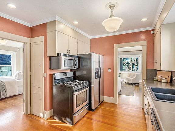 Gas range & new overhead microwave & exhaust vent