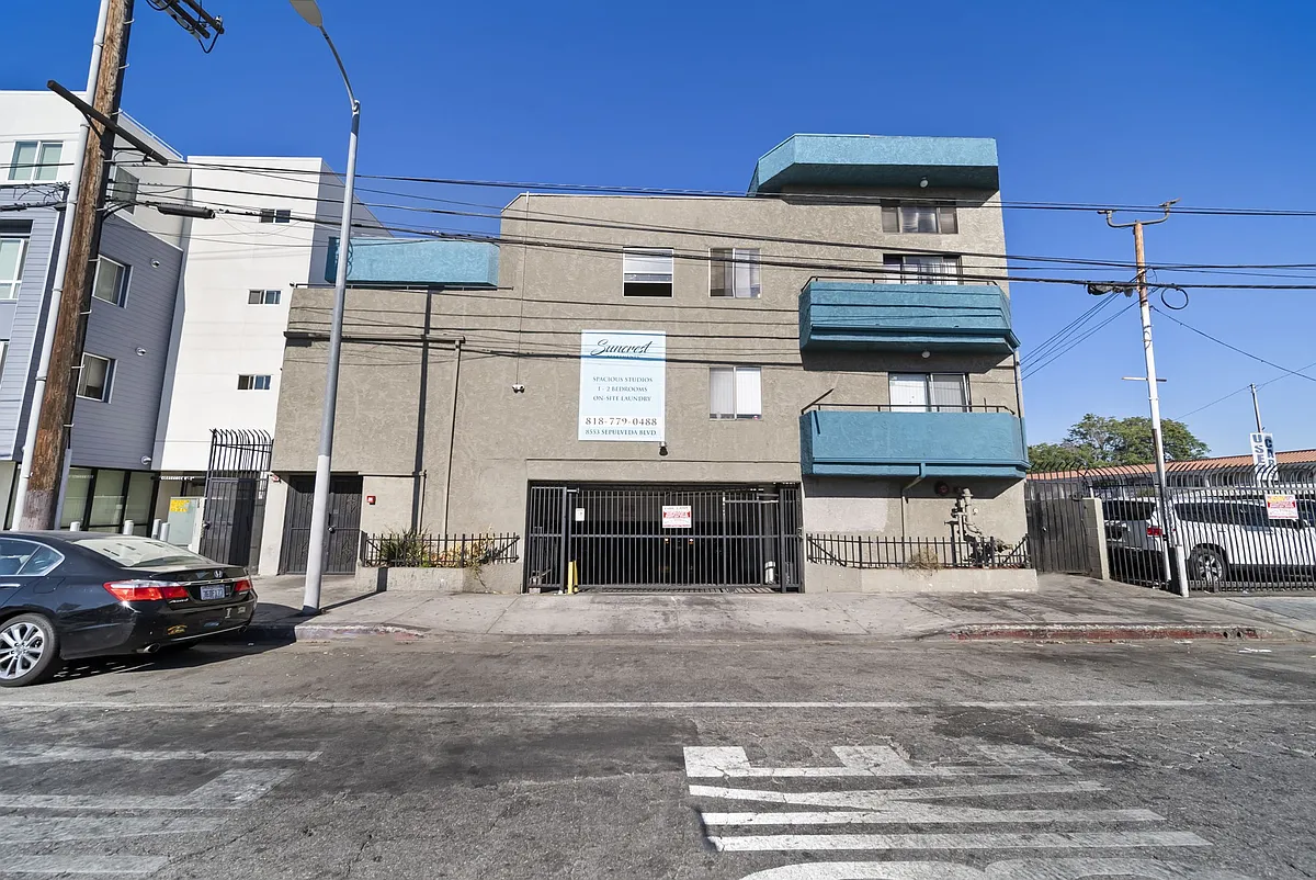 Well-maintained exterior in a convenient location with gated parking for added ease. - Suncrest Apartments