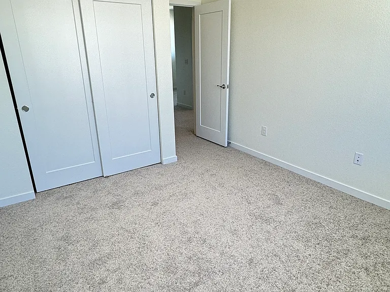 Bedroom # 2 from corner view available May 2026