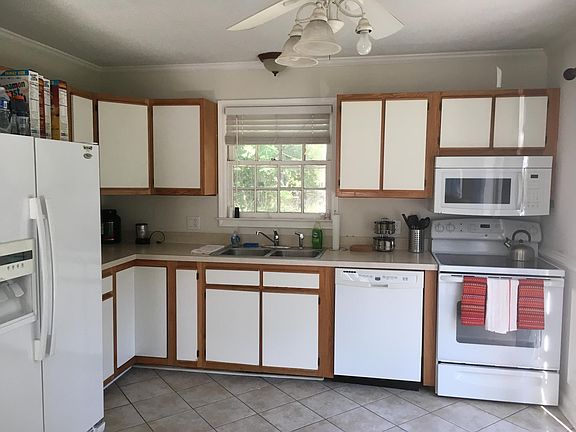 Large kitchen with sliders to new deck.