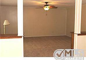 View of Family room from the entry with fresh paint and new carp