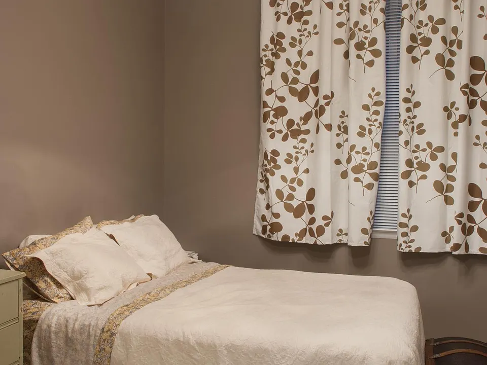 Picture highlighting chandelier in bedroom