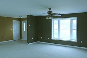 Living room facing front door entry