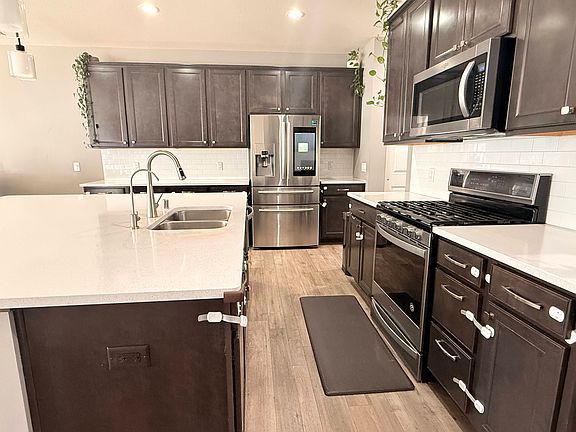 Kitchen with gas stove, mircrowave and oven