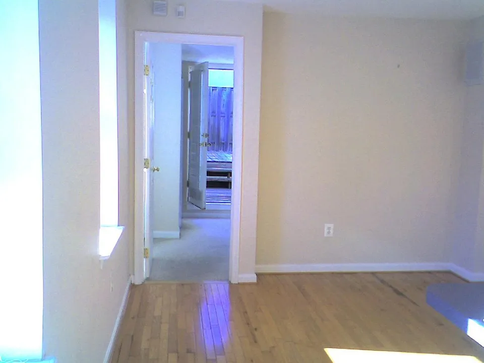 living room looking toward bedroom #2 and private deck