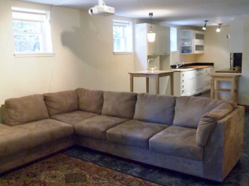 Custom concrete floors with radiant heat throughout. Efficiency kitchen and many windows.