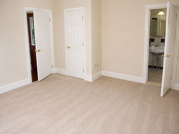 BR with hallway door on left; walk-in closet in middle and bath entrance to the right
