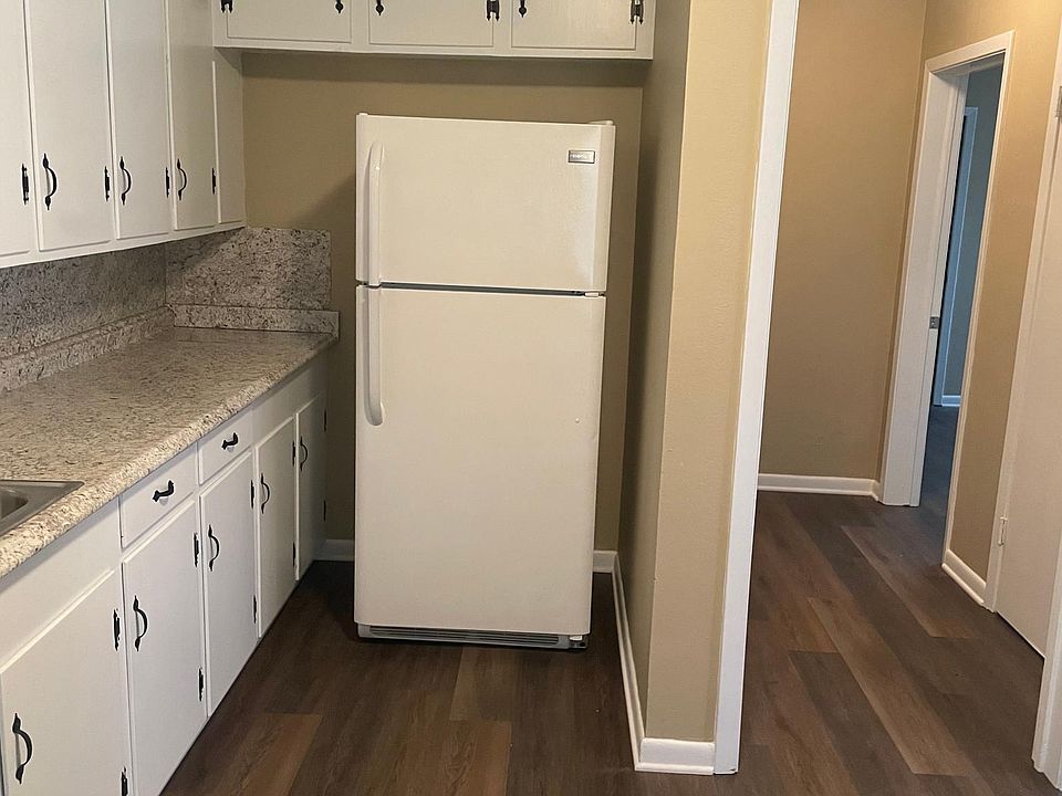 Looking down the hall, the walk-in closet is on the right.