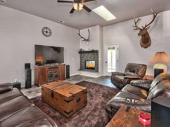 A dual-sided gas-log fireplace warms the living room and adds ambiance to the Co