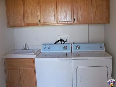 laundry room leads to balcony or back yard