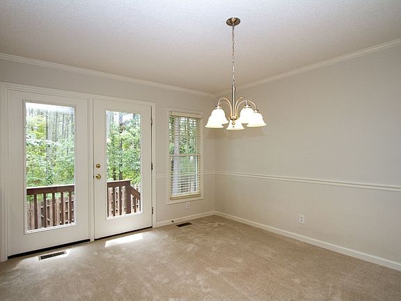 New lighting brightens this cheery breakfast room w/room for a huge table.