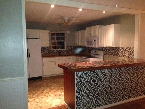 Kitchen (left of fridge is threshold to laundry, pantry, and