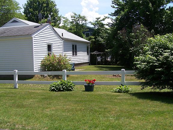 Back of house with small deck