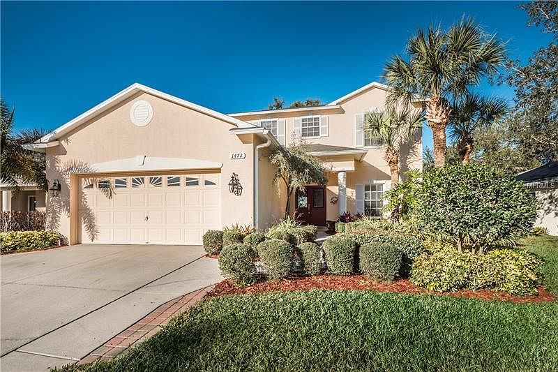 Lovely Front Exterior of home, lush landscaping and fresh paint