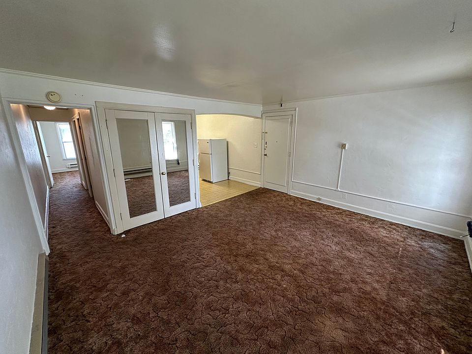 Living room looking towards kitchen and hall.