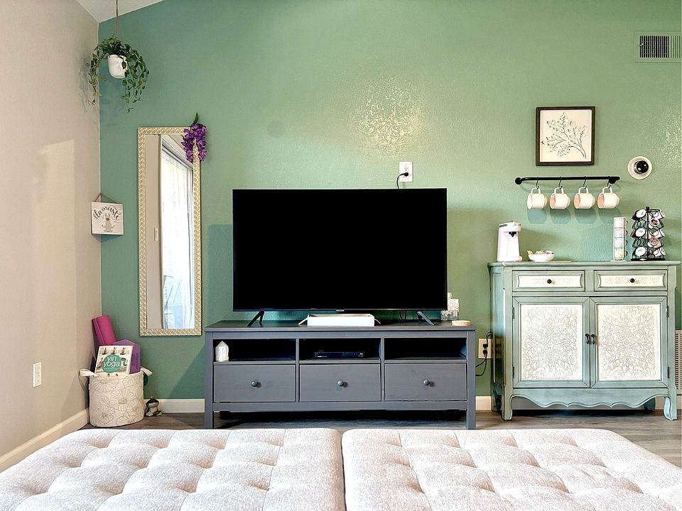 Living area with yoga station, coffee bar, and smart TV