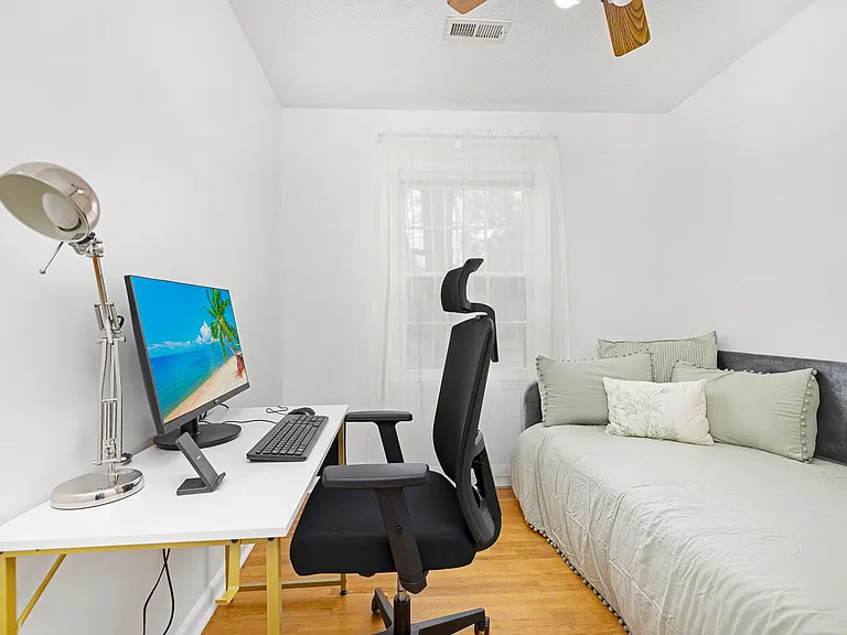 Ergonomically designed workspace with desk, chair, monitor, keyboard and mouse available for your use. There is a twin bed in this room.