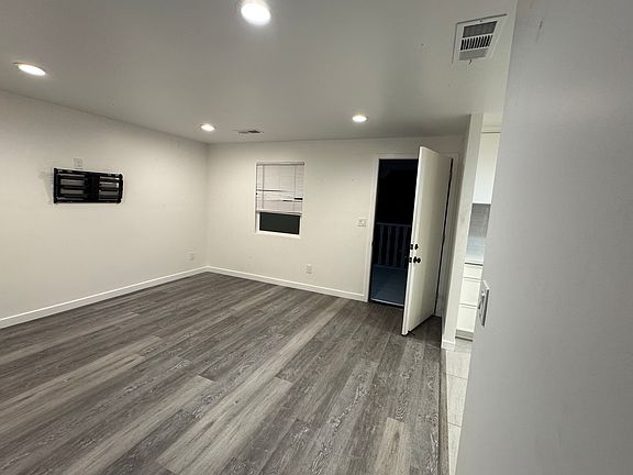 Bedroom - new AC and flooring and in 2024. Deck access.