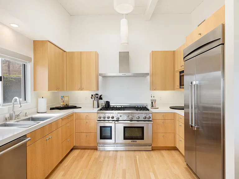 Gorgeous kitchen space perfect for warm gatherings.
Step into the spacious kitchen, complete with state-of-the-art appliances and plenty of natural light.