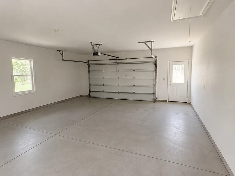Oversized 2-car garage will fit large truck. Also has a large storage room.