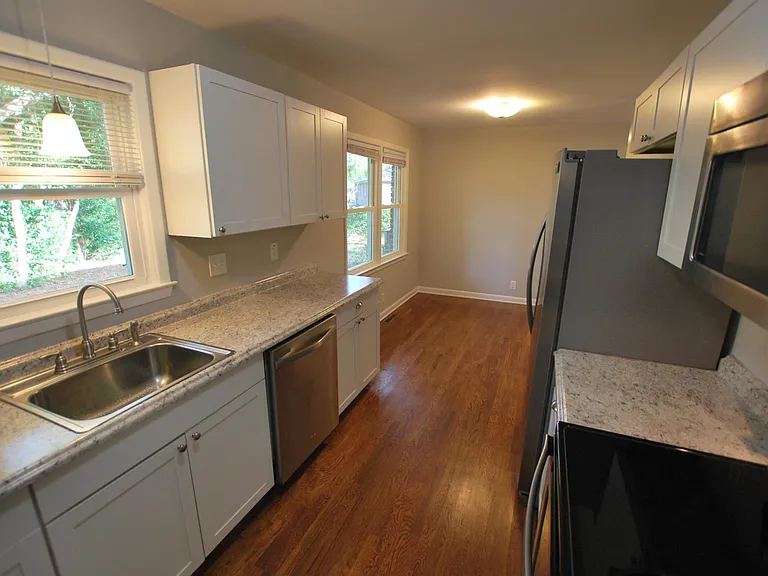 Kitchen with dining area at far end.