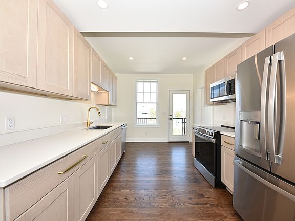Rear Apt - Galley Kitchen looking from Fire Escape Door
