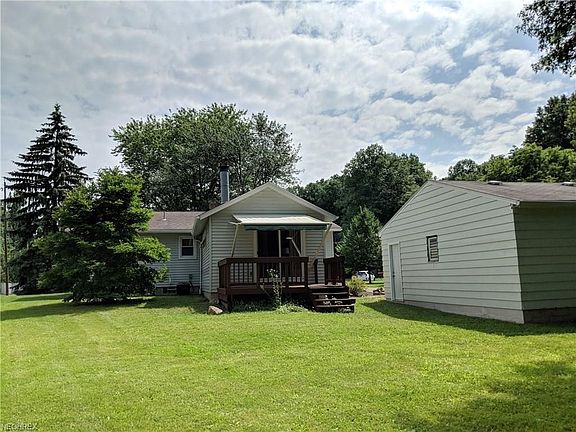 Large back yard and deck with retractable SunSetter awning.