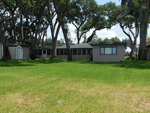 Rear elevation, looking east. All this beautiful lawn you can enjoy without needing to water or mow it!