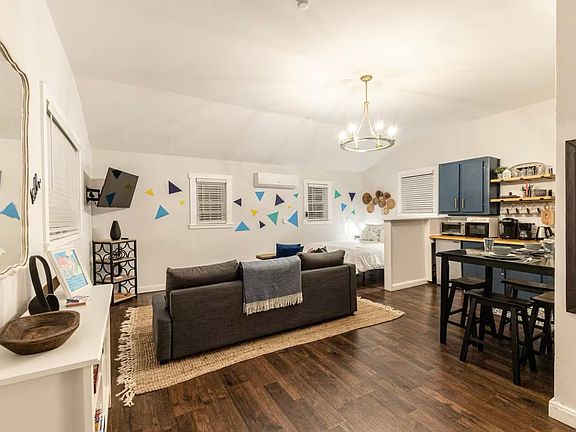 Left side as you walk in the door