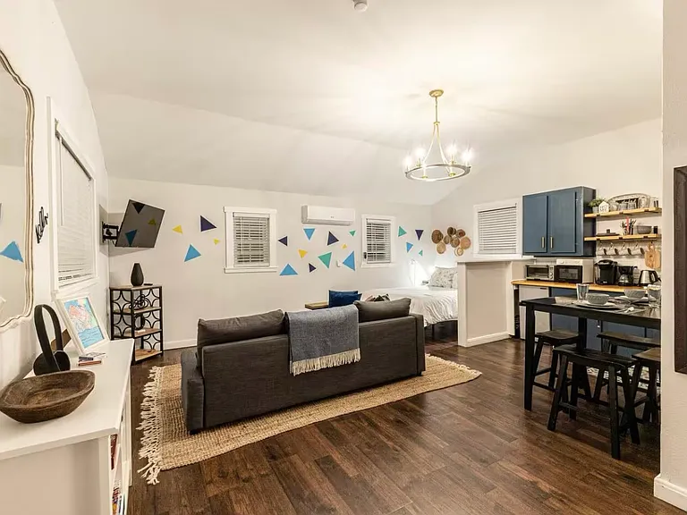 Left side as you walk in the door