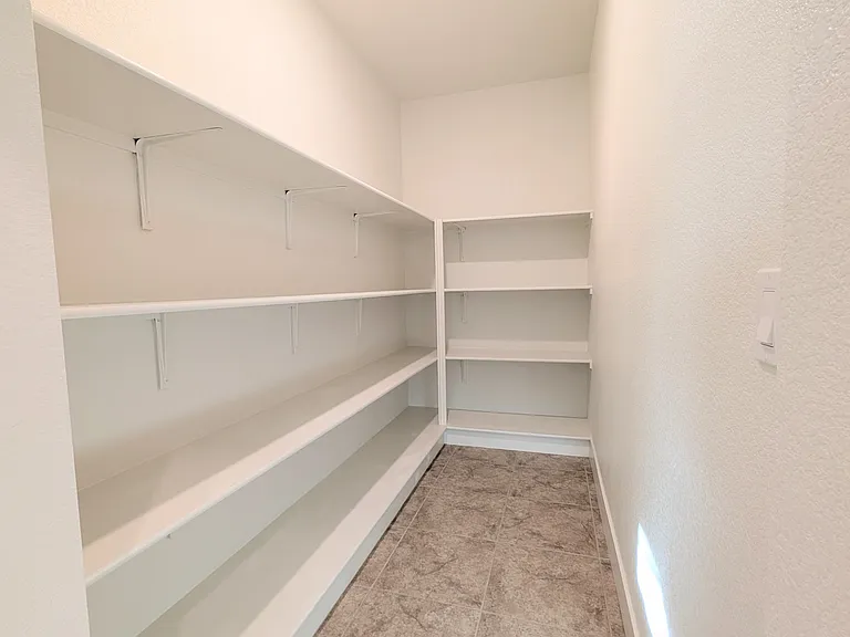 Hidden Walk-in Pantry
Maximize your kitchen potential with this massive, hidden walk-in pantry. With endless shelving and storage, it keeps your gourmet space clutter-free and perfectly organized. An absolute must-have feature for the ultimate home chef.
