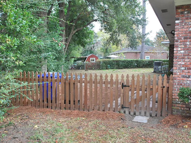 Wooden fence into backyard