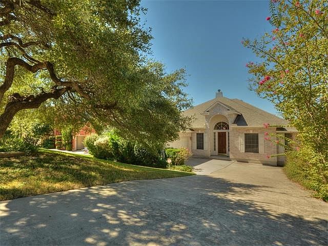 Beautiful one story home with lush landscaping, side entry garage, and large bonus room upstairs with wet bar.